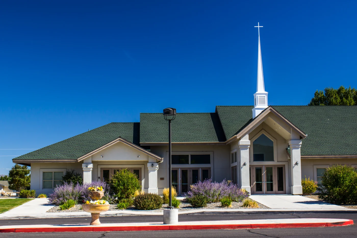 A church with a green shingle roof.