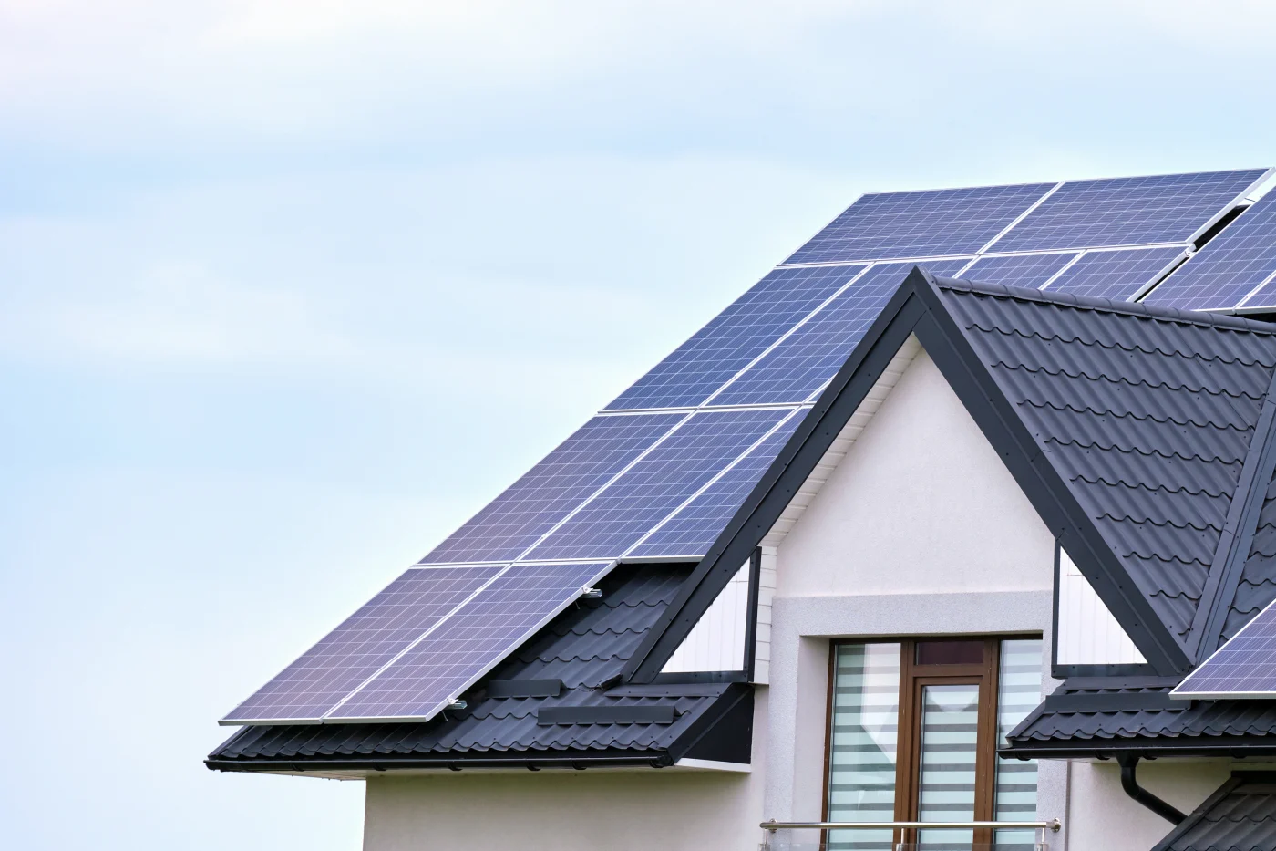 A home with a metal roof and solar panels.