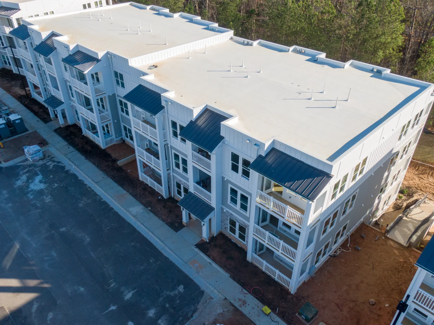 Aerial view of an apartment complex with a TPO roof.