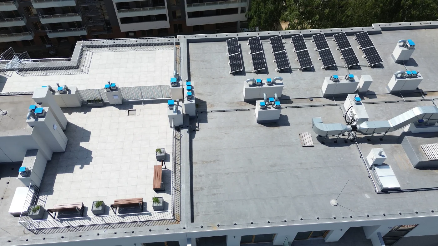 Aerial View Of Rooftop With Hvac Equipment On Modern Apartment Building