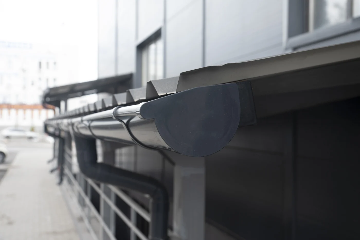 Close Up Graphite Colored Plastic Gutter System, Gutter Plug