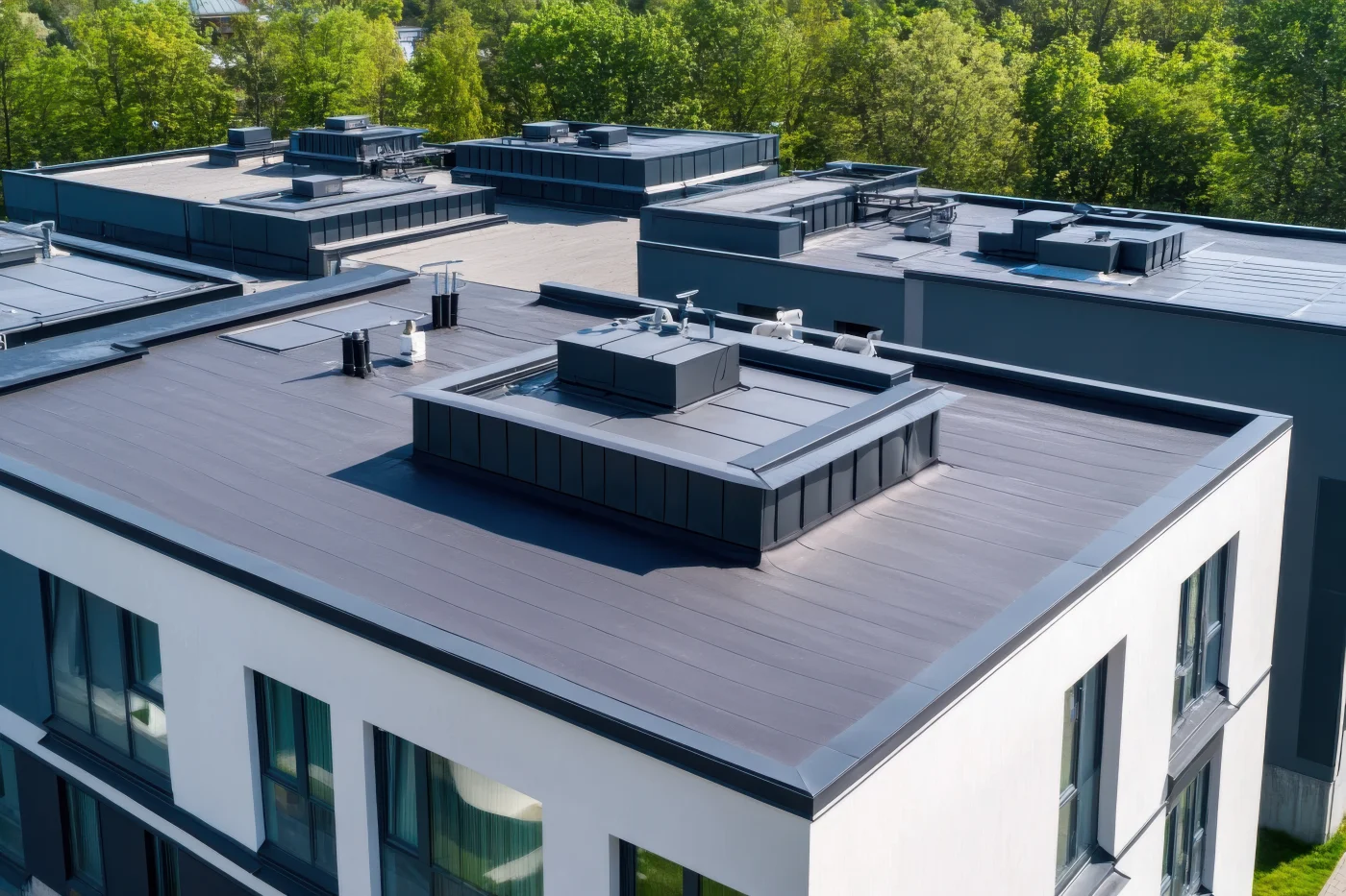 A commercial building with a flat roof system installed.